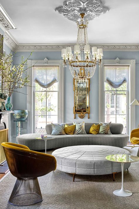 In this Savannah townhouse designed by Chuck Chewning, the living room's  Vladimir Kagan sofa, in a Donghia fabric, is from Ralph Pucci, the Warren Platner chairs, in a Rubelli fabric, are from Knoll, and the custom Natasha Baradaran ottoman is from R Hughes. The window shades are in a Dedar fabric, and the walls are in Sherwin-Williams’s Passive. Italianate Interior Design, Italianate Interior, Warren Platner Chair, Elle Decor Living Room, Italianate House, Platner Chair, Kingston House, Dark Brown Walls, Brown Doors