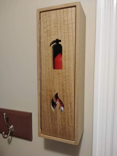 Fire extinguisher box made from red oak. Daughter did the scroll work. Fire Extinguisher Covers, Kitchen Fire Extinguisher Storage, Fire Extinguisher In Kitchen, Fire Extinguisher Box Design, Fire Extinguisher Ideas Diy, Fire Extinguisher Design, Fire Extinguisher Ideas, Fire Extinguisher Box, Fire Extinguisher Cabinets