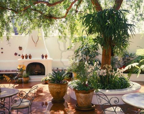 Spanish patio  - built in bench and fireplace and patio tiles Spanish Style Patio, Spanish Patio, Stucco Fireplace, Spanish Courtyard, Spanish Garden, Saltillo Tile, Courtyard Design, Patio Tiles, Mediterranean Home Decor