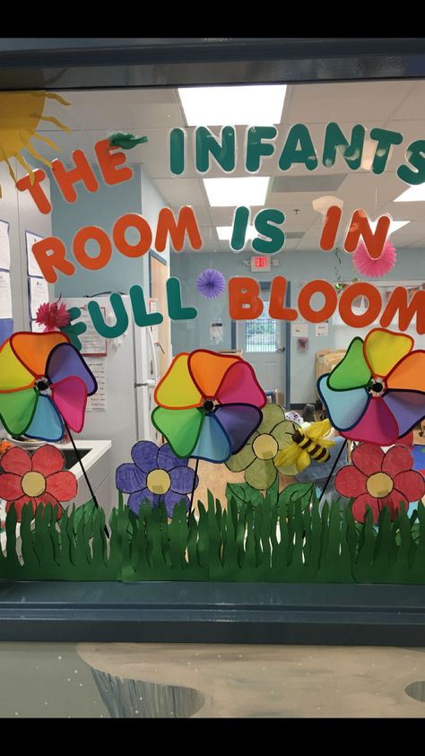 My infants 3-D class window during the spring. Everyone enjoyed the pinwheels! Window Design Classroom, Door Ideas For Infant Classroom, Daycare Window Ideas, Window Decoration Ideas For School, Classroom Window Decor, Lavender Classroom, Infants Crafts, Classroom Window Decorations, Spring Classroom Door