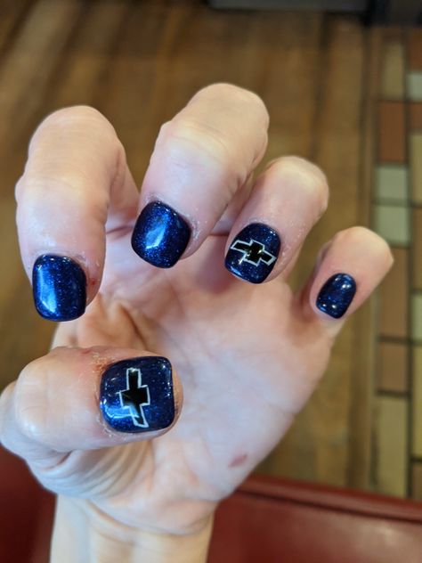 Just got these done to match my new truck! Can't find a lot of chevy nails on here so pls post your chevy nails everyone! Always looking 4 new ideas like these & I'm sure othrs r as well Jeep Grill Nails Designs, Truck Nails, Western Nails With Lightning Bolt, Chevy Nails Designs, Monster Truck Nail Designs, Chevy Nails, Ford Blue Nails, Chevy Bowtie, I Hate Boys