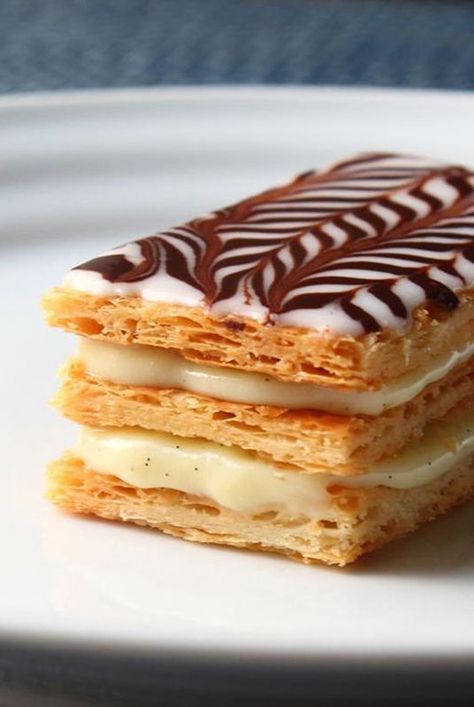 Make Napoleon dessert with Chef John's recipe that uses frozen puff pastry sheets baked perfectly crisp, light, and flaky for layering with cream. #dessertrecipes#dessertideas#dessertdishes#dessertinspiration#sweettreats#bars#dessertbars#barrecipes Napoleon Pastry, Easy Puff Pastry Desserts, Resep Puff Pastry, Napoleon Dessert, Brunch Pastries, Chef John Recipes, Napoleon Cake, Classic French Desserts, Puff Pastry Desserts