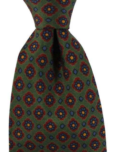 E. Marinella Ties | Wide Neckties E. Marinella Authentic E. Marinella tie, green floral design, hand printed silk, hand made in Italy. Color: Green Fabrics: 100% Silk, Self Tipped Size: Width: 3.5"/ 9cm, Regular Length 58" Origin: Hand Made in Italy Brand: E. Marinella Napoli Original E. Marinella Gift Box ( Flat ) Upon Request Genuine / Authentic Product code: mari220934 E. Marinella is a sartorial quality brand from Napoli, Italy. The E. Marinella tie designs are often classic geometric prints Preppy Menswear, Mens Wardrobe, Green Fabrics, Napoli Italy, Green Floral Design, Tie Matching, Preppy Mens Fashion, Classic Clothing, Geometric Prints