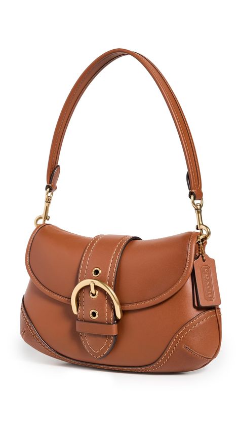 PRICES MAY VARY. Decorative buckle, Gold-tone hardware Length: 11in / 28cm, Height: 6.75in / 17cm, Handle drop: 7.75in / 20cm, Depth: 2.25in / 6cm Fold-over flap with magnetic snap Patch interior pockets Optional strap Glovetanned Soho Bag Rear Delt, Coach 1941, Buckle Bags, Purse Accessories, Cute Bags, Leather Hobo, Friendship Bracelet Patterns, Vintage Handbags, Bracelet Patterns