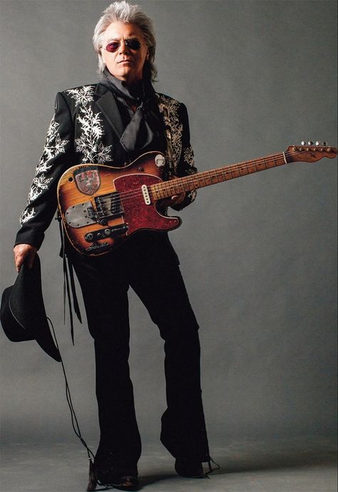 John Marty Stuart (born September 30, 1958) is an American country and bluegrass music singer, songwriter, and musician. Active since 1968, Stuart initially toured with Lester Flatt, and then in Johnny Cash's road band before beginning work as a solo artist in the early 1980s. His greatest commercial success came in the first half of the 1990s on MCA Records Nashville. Stuart has recorded over 20 studio albums, and has charted over 30 times on the Billboard Hot Country Songs charts. Clarence White, Sonny Chiba, Marty Stuart, Hot Country Songs, Cult Of Personality, Bluegrass Music, Country Music Stars, Country Stars, Country Songs