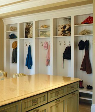 Organizing Small Homes from houseplansandmore.com Between The Studs, Between Studs, Traditional Entry, Small House Organization, Green Backsplash, Mudroom Lockers, Beadboard Backsplash, Cabinets White, House Plans And More