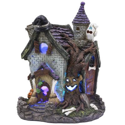 Equipped with LED lights that change colors, this figurine creates a mysterious and spooky atmosphere, enhancing your Halloween decorations. | Alcott Hill® Halloween House Statue Figurine w / Witch's Hat Pumpkin for Halloween Decorations in Purple | 9.4" H X 4.9" W X 4.3" D | Wayfair Pumpkin For Halloween, Stone Garden Statues, Garden Gnomes Statue, Spooky Town, Gnome Statues, Outdoor Party Decorations, Halloween Village, Decor Figurines, Halloween Party Decor