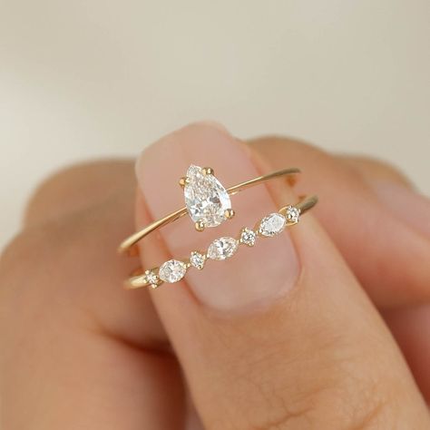 This classic ring features a sparkly, pear cut diamond on a 14k yellow gold band. 1 pear cut lab grown diamond, measuring at 6mm x 4mm Total carat weight: 0.355 14k yellow gold band Elongated Pear Ring, Gold Wedding Ring Pear Shape, Flush Diamond Engagement Ring, 1 Carrot Diamond Ring, Moissanite Yellow Gold Engagement Ring, Pear Cut Gold Ring, Circle Promise Rings, Gold Simple Promise Rings, Cute Small Engagement Rings