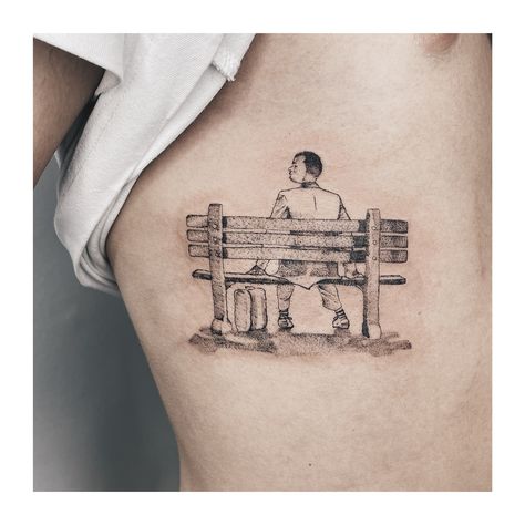 Forest Gump Tattoo Ideas, Box Of Chocolates Tattoo, Forrest Gump Tattoos, Forest Gump Tattoo, Indian Feather Tattoos, Black Men Tattoos, Camera Tattoos, Forest Gump, Max Payne