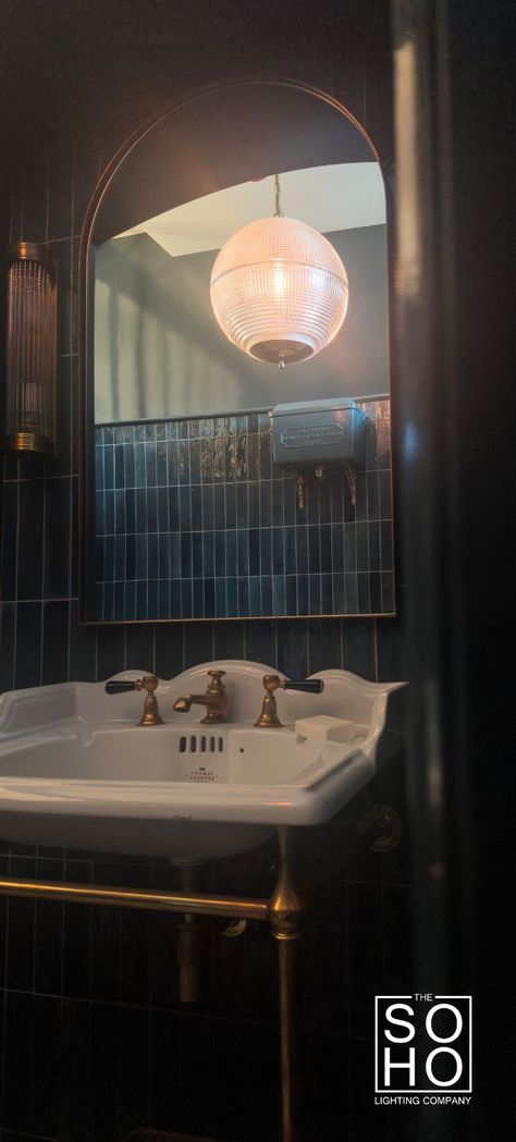 A statement glass pendant hangs in a exquisite bathroom with bottle green tiles and brass elements Victorian Hallways, Bathroom Pendants, Statement Bathroom, Victorian Pendant Lighting, White Brick Tiles, Victorian Hallway, Powder Bathroom, Bathroom Pendant, Bathroom Pendant Lighting