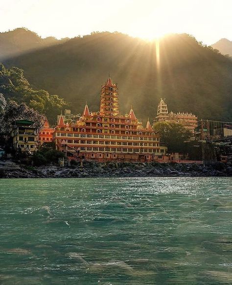 Rishikesh, the World Capital of Yoga, has been one of India's holiest and most spiritual centres for thousands of years. Rishikesh is a magical city on the blue banks of the holy Ganges river and nestled under the gaze of the mystical Himalayas. —————————————————————— #incredibleindia#uttarakhand #himalayas #travelling#devbhoomidarshann#indiantravler#tungnath #chopta#shimla#kedarnath #mahadev #mussoorie #travelphotography #devbhoomi#temple#nature#delhi #love #peace #hikking #exploring#rishikesh Ganga River, Ganges River, Rishikesh, Best Places To Visit, Banks, Temple, Places To Visit, India, Water