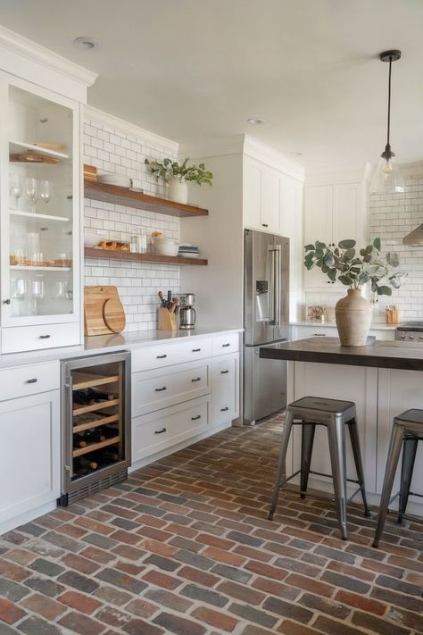 A kitchen with green cabinets and a brick kitchen floor that complements the rustic wooden ceiling. Brick Kitchen Floors, Kitchens With Brick, Brick Kitchen Floor, Brick Floor Kitchen, Brick Floors, Kitchen Flooring Ideas, Brick Floor, Kitchen Floors, Brick Kitchen