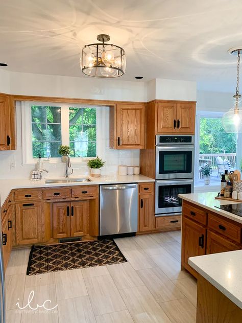 Oak Cabinet White Backsplash, Oak Cabinets With Grey Walls, Kitchen Floor Tile With Wood Cabinets, Flooring Ideas For Oak Kitchen Cabinets, Black Counters With Oak Cabinets, Wood Cabinets Gray Floor, Kitchen Flooring Ideas Wood Cabinets, Cheap Wood Cabinets, Small Kitchen Remodel Oak Cabinets