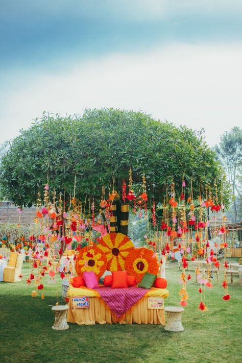 Beautiful mehendi setup under a tree with colourful tassels | WedMeGood|#wedmegood #indianweddings #indiandecor #decorideas #tassels #tasseldecor #mehendidecor #mehendiseats Outdoor Mehendi Decor Ideas, Indian Wedding Theme, Mehendi Decor Ideas, Mehendi Decor, Henna Wedding, Wedding Background Decoration, Marriage Decoration, Desi Wedding Decor, Drink Bar