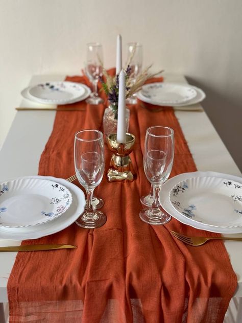 Rust terracotta boho table runner is a decorative fabric piece that is placed on a table to add a rustic, nature-inspired touch to wedding decor. MATERIAL: 100% Cheesecloth gauze runner The size - the width of the runner is 35 inches (90 cm) . Select the desired length or apply for an individual order. NOTE - Hand wash only 30;  No ironing required to maintain wrinkled texture;  No dry cleaning ATTENTION! Due to the handmade process of dyeing, some imperfections, pigment marks, and color variati Terracotta Centerpieces, Boho Wedding Party, Centerpieces For Wedding, Boho Table Runner, Wedding Party Decor, Boho Style Wedding, Wedding Elegant, Aisle Runner, Decor Pieces