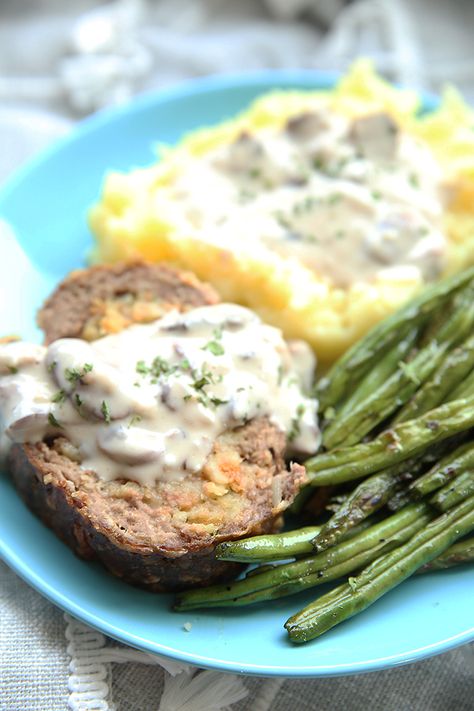 Stuffed meatloaf green beans and mashed potatoes on a plate the meat loaf and mashed potatoes have a mushroom gravy on them Stuffed Meatloaf, Marinated Pork Chops, Manicotti Recipe, Classic Meatloaf Recipe, Slow Cooker Recipes Beef, Eating Fast, Mushroom Gravy, The Mushroom, Slow Cooker Beef