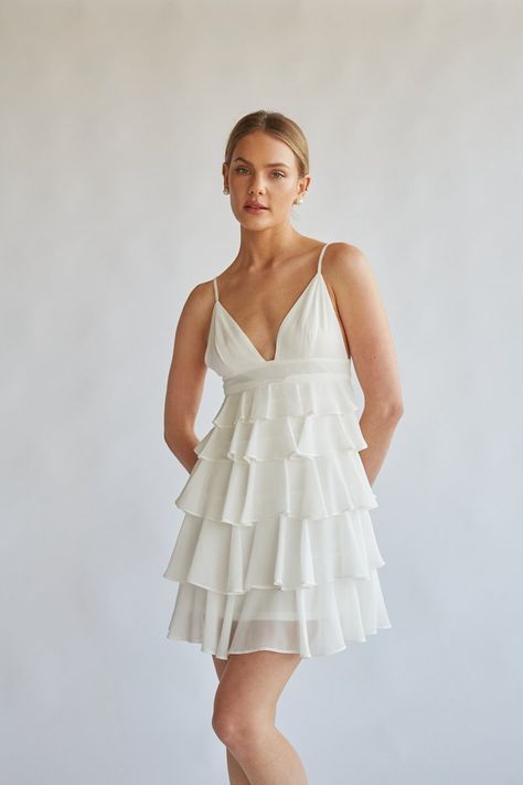 White Mini Dresses for Graduation Class of 2024 - What to Wear for Graduation — Every Little Thread What To Wear For Graduation, White Grad Dresses, White Grad Dress, White Mini Dresses, Dresses For Graduation, Dainty Accessories, Tiered Ruffle Mini Dress, Beautiful Mini Dresses, White Bridal Dresses