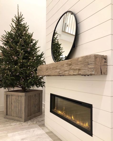 OUR MANTLE IS UP!!!! We finally have a fireplace mantle!! It took us half a day to install and we’ve waited nearly 4 months to get this but it is finally here and finally up and we LOVE it!!! This is a real old weathered hand-hewn barn beam (it actually has huge notches out of the back and underside that I actually love (I debated even having those face the front but ultimately decided on this cleaner look). It’s anchored to 5 studs by chunky steel brackets and bolts on the top and bottom ... A House We Built, Barn Beam Mantels, Beam Mantel, Wall Mounted Fireplace, Wall Mount Fireplace, Wood Mantle, Fireplace Built Ins, Farmhouse Fireplace, Wood Mantels