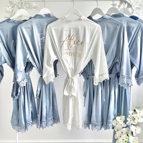 Our personalised satin robes are perfect for the Bridal Party the morning of your wedding. The Glamorous morning of the wedding robes are soft to the touch and have beautiful decorative lace piping. We have a wide range of colours to choose from, select your colour and then we hand personalise with your role and name on the back of the robe in either white, black, gold , rose gold or silver. If you would prefer a different colour please send me a message and this can be arranged. HOW TO ORDER: Blue Bridesmaid Robes, Bridesmaid Robes Blue, Bridal Party Robe, Morning Of The Wedding, Wedding Dressing, Bridesmaids Robes, Wedding Robes, Satin Robes, Bridal Party Robes