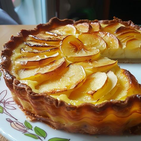 Apple and Yogurt Flan Recipe This beautiful tart is a delicious blend of creamy yogurt flan topped with tender, caramelized apple slices. It's a perfect dessert for any occasion, combining the richness of a flan with the fresh sweetness of apples. Ingredients For the Pastry: 1 1/4 cups (160g) all-purpose flour 1/2 cup (115g) unsalted butter, cold and cubed 1/4 cup (50g) granulated sugar 1/4 teaspoon salt 1 large egg yolk 2-3 tablespoons ice water For the Filling: 3 large apples, peeled, co... Apple And Yogurt, Flan Pan, Savory Baking, Patisserie Cake, Flan Cake, Creamy Yogurt, Caramelised Apples, Flan Recipe, Savoury Baking