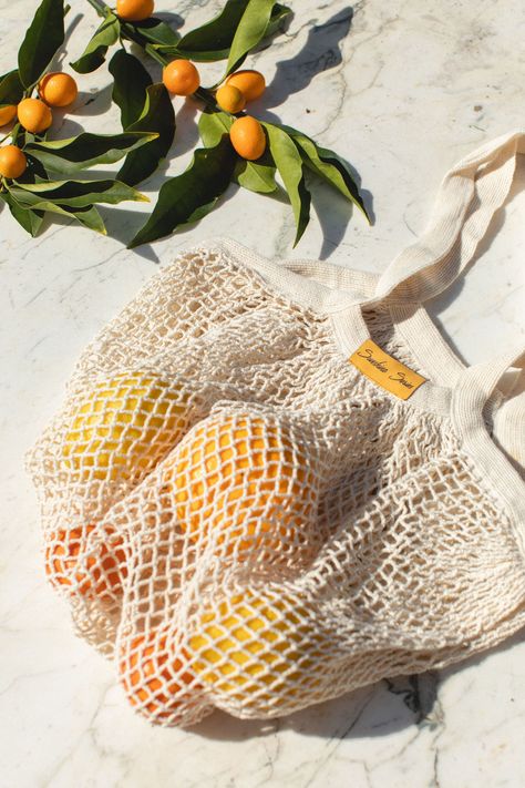 Our new Organic Cotton Net Tote is a lovely swap for plastic bags! Lightweight & highly durable, these totes stretch & can hold up to 40 lbs making them stronger than your average grocery bag. Perfect for your trip to the farmers market or day at the beach. Made for 100% Organic Cotton 12.5" W x 13" HHandles are approximately 5" Plastic Free Packaging Highly Durable. Can hold up to 40 lbs Machine Washable. Hang Dry. Ethically Made, Imported End of Life: biodegradable Sustainable Hacks, Reusable Produce Bags, Beach Trips, Green Sky, Produce Bags, Net Bag, Eco Bag, Market Tote, Plastic Bags