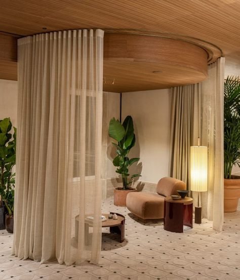 The spa waiting area features seating within sheer curtain enclosures. Earthy Interiors, Italian Palazzo, Small Seating Area, Hotel Lobby Design, Rome Hotels, Six Senses, Travertine Floors, Lobby Design, Hotel Project