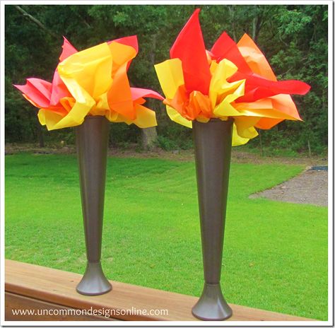 Olympic torch from spray-painted plastic drinking glass ($ store) and tissue paper. Great centerpiece! Olympic Torch Craft, Torches Diy, Office Olympics, Olympics Decorations, Olympic Theme Party, Olympic Games For Kids, Olympic Idea, Olympic Crafts, Beer Olympic