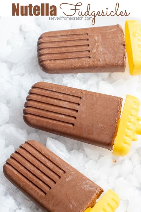 4 hours · Gluten free · Serves 6 · It's favorite frozen chocolate summer treat but with made from scratch Nutella! These Nutella Fudgesicles are the classic fudgy treat but with hazelnut and cacao for a touch of added nutrition! Paleo Nutella, Nutella Popsicles, Iced Coffee Popsicles, Fudge Popsicles, Coffee Popsicles, Clean Eating Vegan, Paleo Banana, Homemade Nutella, Banana Nutella