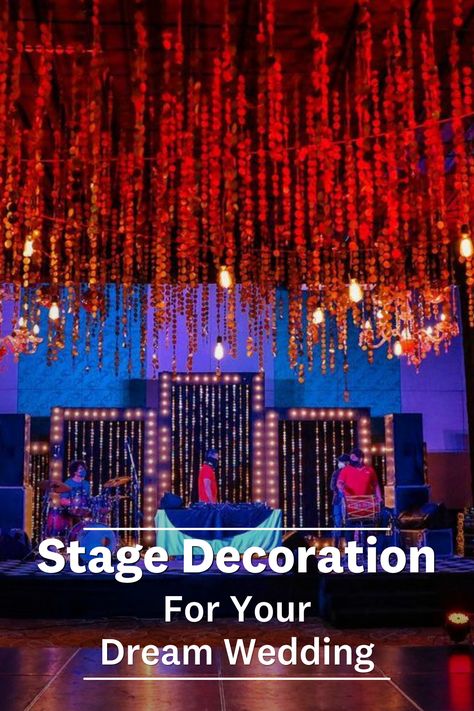 Looking for simple yet elegant ways to decorate your wedding stage? We have got you covered with these inspiring simple stage decoration ideas that are not only appealing to the eyes but are also budget-friendly. Have a look! Stage Decoration Ideas, Hanging Paper Flowers, Simple Stage Decorations, Fairy Lights Wedding, Easy Backdrops, Stage Decoration, Stage Backdrop, Wedding Hashtag, Wedding Stage Decorations