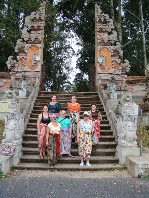 Entering a lovely temple situated in a wooded area right in the middle of many lovely rice fields.  We have donned our sarongs and are ready to explore. When entering temples it is courteous for women to wear a sarong and sash. Wooded Area, Smiling People, Rice Fields, Sarong, In The Middle, The Middle, Creative Art, Bali, Temple