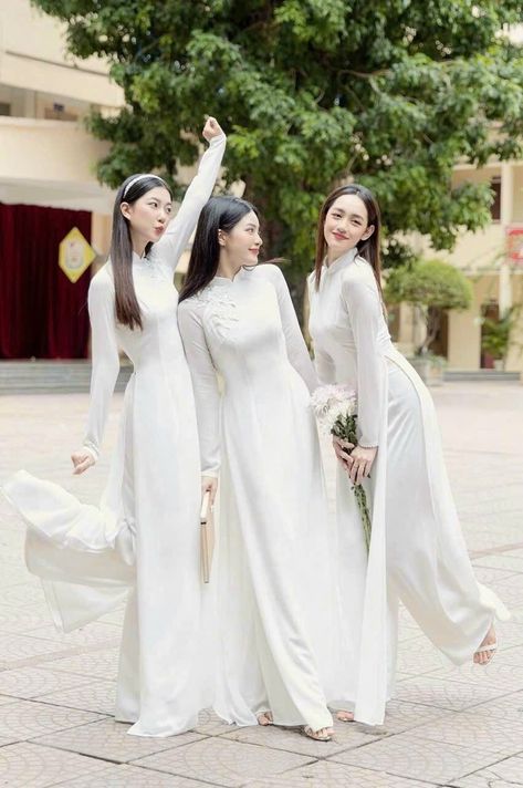 At Ao Dai by CuteSass, you will find the most stylish ao dai in wide size range and at reasonable prices. We are moving our ao dai collection from CuteSass here to provide you with the best experience.  You can read our 5000+ reviews at: cutesass.etsy.com ❣️ This set includes one Ao Dai Top and 1 Pants Style: Traditional  Material: Chiffon Top, Silk Pants. Stretchy ❣️ This beautiful and modern ao dai set is perfect for any special occasions: Lunar NewYear, Mid Autumn Festival, Attending Wedding, or a Family photoshoot. ❣️ Please note: - Sizing may run 1-2 sizes smaller than American standard sizes, please refer to the sizing charts for sizing. - Please contact me if you have any questions ❣️We are proud to provide you with the highest quality fabric, handpicked modest colors, and wide-rang Ao Dai White, Vietnamese Tea, Wedding Rehearsal Dress, Modern Ao Dai, Vietnamese Fashion, Vietnamese Ao Dai, Vietnamese Wedding, Dress Design Patterns, Autumn Festival