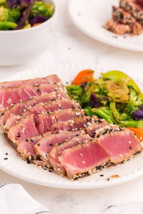 These Grilled Ahi Tuna Steaks are marinated in a flavorful soy sauce and honey marinade then perfectly seared on each side. Steak Calories, Grilled Ahi Tuna Steak Recipe, Grilled Ahi Tuna, Tuna Steak Marinade, Honey Marinade, Ahi Tuna Steaks, Ahi Tuna Steak Recipe, Tuna Steak Recipe, Grilled Tuna Steaks