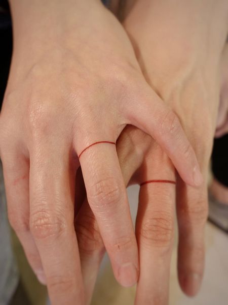 Promise Ring Tattoo Couple, Matching Wedding Tattoo Ideas, Pinky Ring Tattoo, Red String Ring, Red String Tattoo Couple, Ring Tattoo Couple, Red Knot Tattoo, Couple Ring Tattoos Marriage, Red String Theory Tattoo