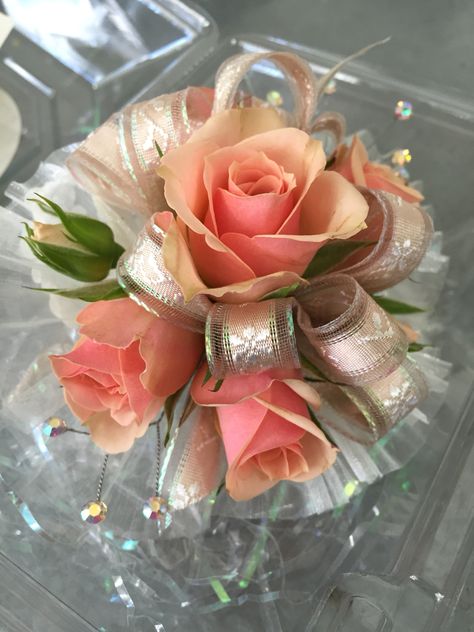 Wristlet corsage with peachy pink spray roses Peach Corsage Prom, Peach Corsage, Prom Corsage Diy, Wristlet Corsage, Hot Pink Prom Dress, Prom Flowers Corsage, Wrist Corsage Prom, Prom Corsage And Boutonniere, Diy Corsage