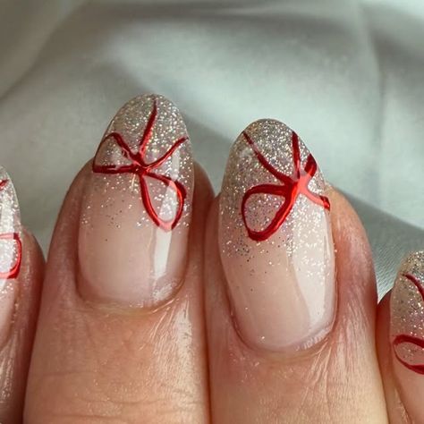 Carys barnes on Instagram: "🎀 help me tie a bow 

Shona let me decide today what was putting on so thought these was very pretty to recreate. They was inspired by @nailsbyheather.errington 

Products used: 
@nailstampingqueenuk  red chrome 
@dali.artistic  white glitter gel polish 

#nails #christmasnails #bownails #festivenails #nailsofinstagram #nailsonfleek" Red With White Chrome Nails, Glitter Bow Nails, Red Chrome Nails With Bow, Christmas Bow Nail Designs, Christmas Nails Sparkly Red, White Glitter Gel Polish, Red Chrome Christmas Nails, Red Bow Nails, Christmas Nails Chrome