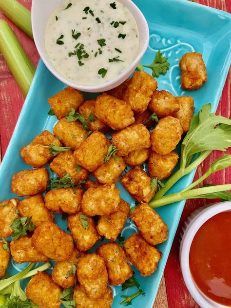 Buffalo Wing flavored tater tots with a creamy garlic, Blue cheese dipping sauce is perfect for game day or any day! Easy appetizer recipe! Tator Tot Recipe, Blue Cheese Dipping Sauce, Tater Tot Recipes, Blue Cheese Dip, Tator Tots, Easy Appetizers, Game Day Snacks, Tater Tots, Homemade Chili