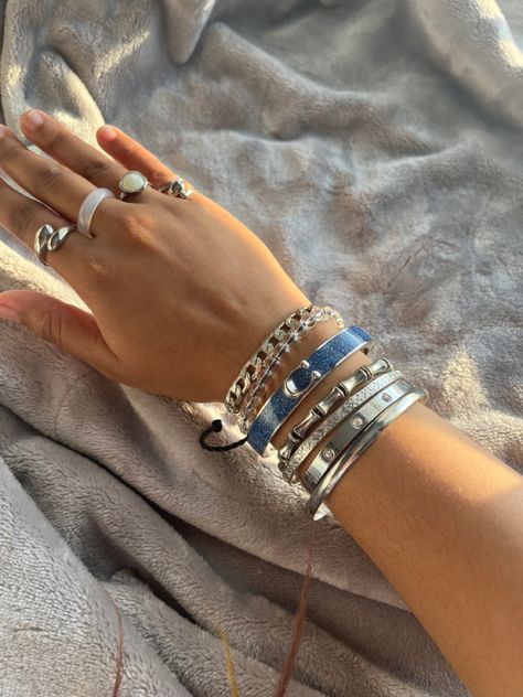 @Iwannag0t0plut0 Silver Rings Stacking, Hand Stacking Bracelet, Good And Silver Jewelry Together, Silver Jewelry Girl, Stacked Rings Aesthetic Silver, Silver Jewelry Stack Bracelets, Silver Bangle Stack, Silver Stacked Bracelets, Chunky Silver Bracelets