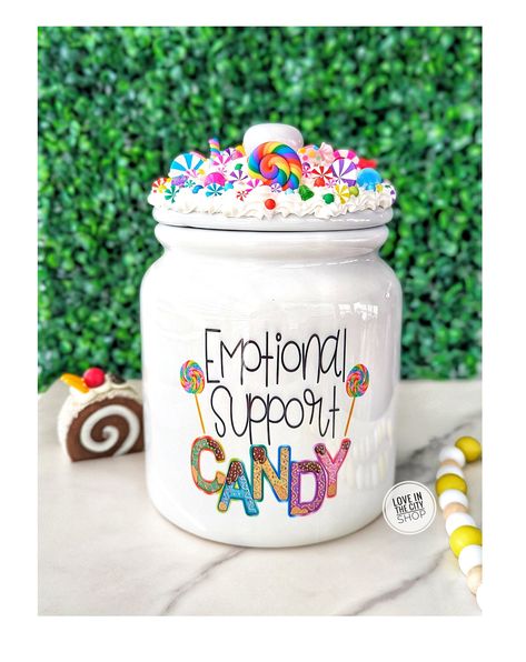 "A fake frosting candy jar that includes a fake candy frosting topper.  A perfect office candy jar or candy jar for home to store your favorite candy. Item Description: 6\" x 8.5\" tall (6.5\" tall w/o lid) Ceramic White Jar Design is sublimated on jar. This means the specialty ink is printed/infused directly to jar and will not peel/fall off. (All items come with a product care card) Frosting is made of a polymeric material with fake sprinkles and candy designs. Item Care: Not Dishwasher/Microw Emotional Support Candy Jar, Office Candy Jar, Fake Frosting, Product Care Card, Candy Jars Diy, Marshmallow Crafts, Jars Diy, Fake Candy, Fake Food Props