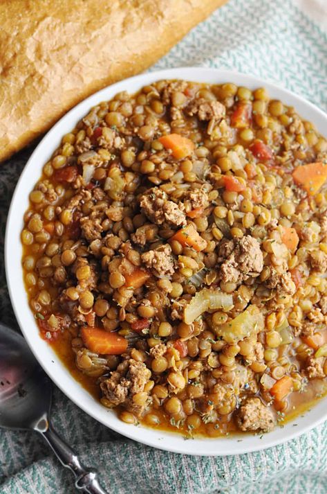 Lentil soup with ground turkey served with bread Macro Friendly Lentil Soup, Lentil Recipes For Diabetics, Ground Turkey Lentil Recipes, Lentil And Ground Turkey Recipes, Lentil Turkey Soup, Ground Turkey Lentil Soup, Ground Turkey And Lentils Recipes, Turkey And Lentil Soup, London Broil Crock Pot Recipe