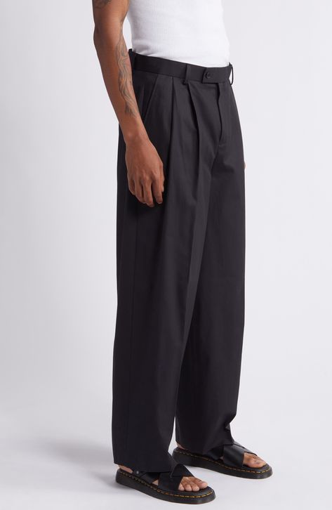 A versatile hue distinguishes these cotton trousers tailored in a wide-leg fit that looks smart when worn either casual or formal. 31 1/2" inseam; 21" leg opening; 13" front rise; 16 1/2" back rise (size 32x34) Zip fly with button-tab closure Side-seam pockets; back welt pockets 100% cotton Machine wash, line dry Imported Men’s Trousers Casual, Formal Street Style Men, Dress Pants Outfits Men, Men’s Trousers, Mens Black Slacks, Mens Dark Academia Fashion, Mens Pants Fashion Trousers, Mens Black Trousers, Pleated Pants Men