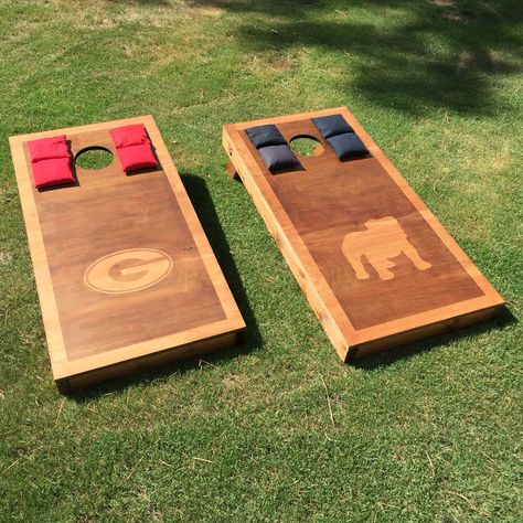 UGA Georgia Bulldogs ACA stained Cornhole boards I made using Varathane honey oak and Minwax espresso stains regulation Baggo Bags beanbag toss game Uga Cornhole Boards, Stained Cornhole Boards, Beanbag Toss, Regulation Cornhole Boards, Torch Wood, Cornhole Designs, Custom Cornhole Boards, Wood Items, Cornhole Board