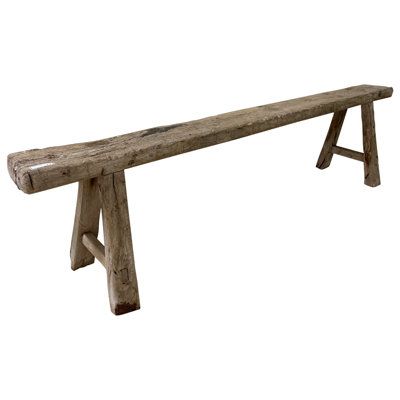 Add versatility to your indoor or outdoor area with benches by Loon Peak®. Set this bench in the living room, bedroom, kitchen, office or any room where you would like to gather together with friends and family. The timeless design, combined with a weathered natural wood finish, perfectly matches many styles. Intricate detailing is meticulously sculpted by hand and each line and curve carefully placed to accentuate its wooden surface. Complete your home with furniture from Loon Peak®! | Loon Pea Noodle Bench, Antique Bench, Solid Wood Benches, Accent Seating, Vintage Bench, Into The Wood, End Of Bed Bench, Vintage Stool, Round Stool