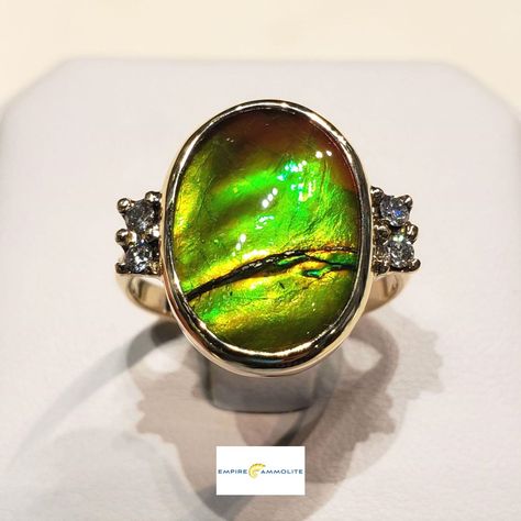 Canadian Ammolite Ring with a 10x16mm Ammolite Gemstone and Six Accent Diamonds set in 14K Yellow Gold. The Ammolite Gemstone has Red, Green and Yellow Colours with significant colour change. Additional Information is Available Here: https://www.empireammolite.com/search?q=E20871 A Personal Rainbow for Every Day of Your Life! Empire Ammolite is a Jewelry design, manufacturing business that supplies Unique Products using Natural Gemstones. All of our Metals are poured in Nort.. Ammolite Ring, Oval Rings, Unique Products, Piece Of Me, The Rings, Yellow Color, Ring Set, Turquoise Ring, Natural Gemstones