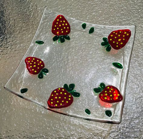 "Fused glass strawberry plate with beautiful red strawberries and little green leaves. What a cheerful dish! This plate was Contour fused for a beautiful texture. Each piece retains its individual character, while edges are soft and rounded. Please note that all my items are Handmade so there may be slight color and / or design variations. A beautiful plate, perfect for decoration, as a Jewelry keeper, soap dish, ring holder, or for serving appetizers and sweet treats. Measures about 5\" x 5\". Fused Glass Ring, Fused Glass Designs, Fused Glass Soap Dish, Fusion Glass Ideas, Fused Glass Art Ideas, Glass Strawberries, Fused Glass Ideas, Strawberry Plate, Fused Glass Plates Bowls