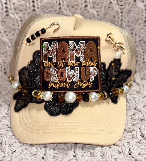 TRUCKER HAT Iron On Patches Boujee Hat Chain Black Lace Flower Mamas Don't Let Your Babies Grow Up Without Jesus Bow Pin Pearl Rhinestone  Khaki cap with pearl/black beaded hat chain, large black flower lace, a bow pin with a pearl dangle, a pin with black beads and the center patch says Mamas Don't Let Your Babies Grow Up Without Jesus. Hat Chain, Sublimation Business, Grow Up, Diy Hats, Rhinestone Accessories, Cheer Team Gifts, Statement Socks, Diy Clothes Hacks, Custom Trucker Hats