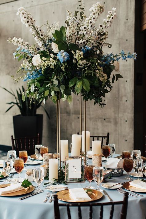 White rose, white delphinium, blue delphinium, lysimachia, white snapdragons, blue thistle, queen anne's lace, bunny tail - tall gold stand, pillar candles, aspen votives - tall round table centerpiece Tall Round Table, Round Table Centerpiece, White Delphinium, Delphinium Blue, Blue And White Wedding, Blue Centerpieces, Blue Thistle, Blue Delphinium, Queen Anne's Lace