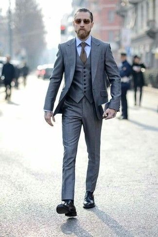 "grey three piece suit and a light blue oxford shirt [...] black leather dress boots". From Looktastic: https://lookastic.com/men/looks/grey-three-piece-suit-light-blue-dress-shirt-black-dress-boots/27230 Grey Mens Suit, Gentleman Mode, Grey Suit Men, Dress Leather Boots, A Man In A Suit, Light Blue Dress Shirt, Man In A Suit, Mens Fashion Blog, Groomsmen Suits