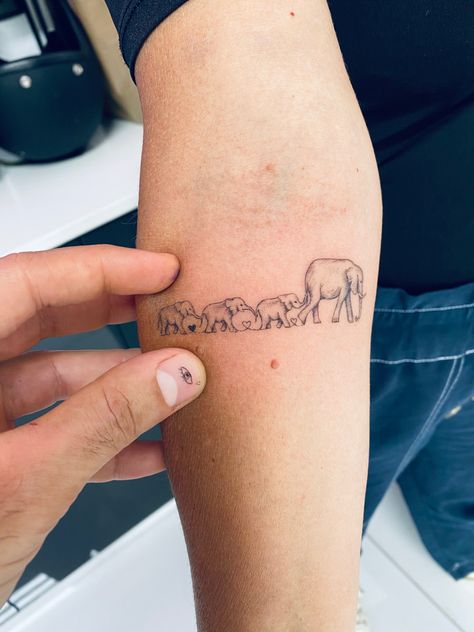 Elephant Chain Tattoo, Four Elephants Tattoo, Elephant Tattoos For Mom, Four Elephant Family Tattoo, Herd Of Elephants Tattoo, 4 Elephants Tattoo, Elephant With Baby Tattoo, Fine Line Elephant Family Tattoo, Elephant Family Tattoos For Women