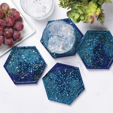 Explore outer space with these galaxy-inspired Mod Podge Resin coasters. Use the Mod Podge Resin mold, glitter, and more to make your coasters look like a collection of stars in the Milky Way. Galaxy Resin Coasters, Resin Coasters Diy, Space Themed Desserts, Diy Resin Coasters, Galaxy Crafts, Coasters Diy, How To Make Resin, Mod Podge Crafts, Budget Crafts