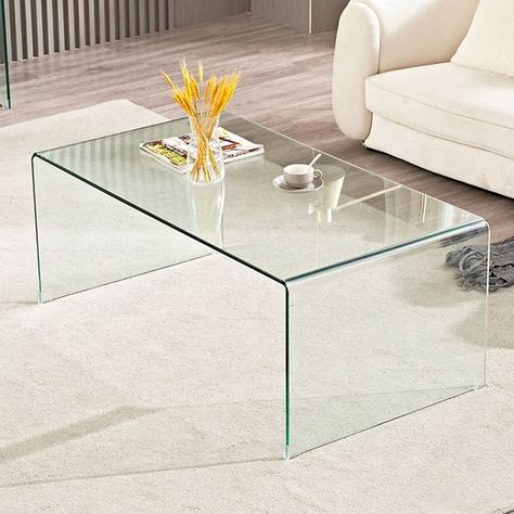 Add a touch of sophistication to your living room with this clear glass coffee table. Its modern design and tempered glass construction make it both stylish and durable, while its compact size is perfect for smaller spaces. #coffeetable #glass #temperedglass #modern #livingroom #homedecor Upholstered Table, Clear Coffee Table, Coffee Table Glass, Modern Glass Coffee Table, Glass Cocktail Tables, Round Glass Coffee Table, Acrylic Coffee Table, Coffee Table Modern, Round Cocktail Tables